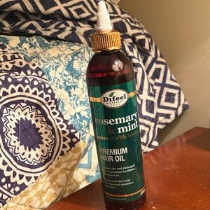 Premium hair oil stimulates hair growth & healthy cuticle for stronger hair